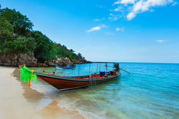 Fototapeta na wymiar Long boat and tropical beach, Andaman Sea, Thailand