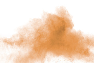 Freeze motion of brown dust explosion. Stopping the movement of brown powder. Explosive brown powder on white background.
