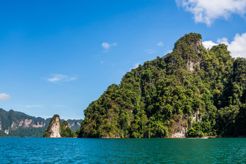 Plakat Beautiful nature rock mountains cliff and blue emerald water color lake river with blue clear sky in Ratchaprapa Dam at Khao Sok National Park, Surat Thani Province, Thailand. Asia tourism location.