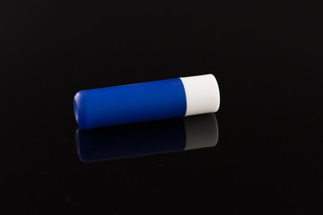 chat stick blue tube isolated on black background