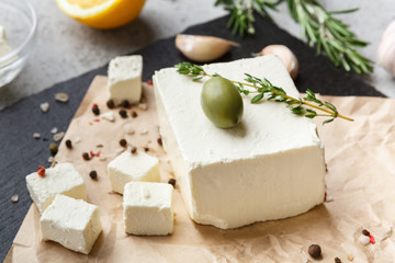 Cubes of feta cheese and spices on board