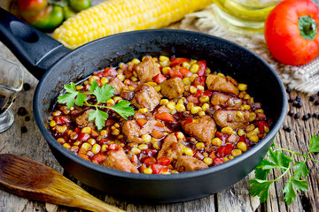 Mexican meat - pork stewed with vegetables corn, pepper, onion, carrot in gravy