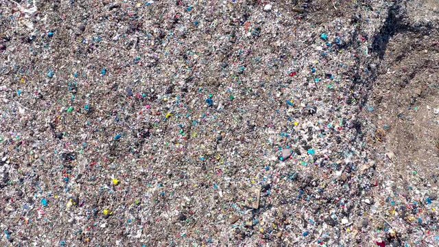Environmental pollution.  Aerial top view from flying drone of large garbage pile. Garbage pile in trash dump or landfill
