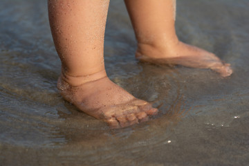 Baby feet in a beach