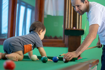 Baby boy playing with his father 