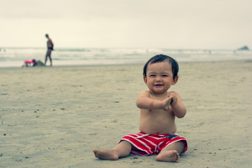 Baby boy in the beach fun traveling with kids funny smile