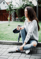 Beautiful girl is resting in the park.