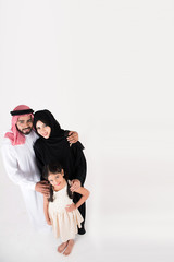 Arab family standing on white background