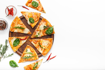 Sliced cheese pizza served on wooden board