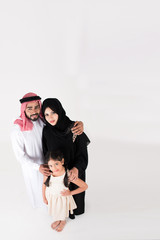 Obraz premium Arab family standing on white background