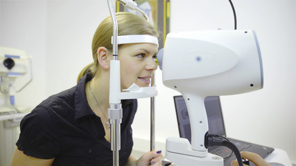 Scanning person eyes with professional optic equipment