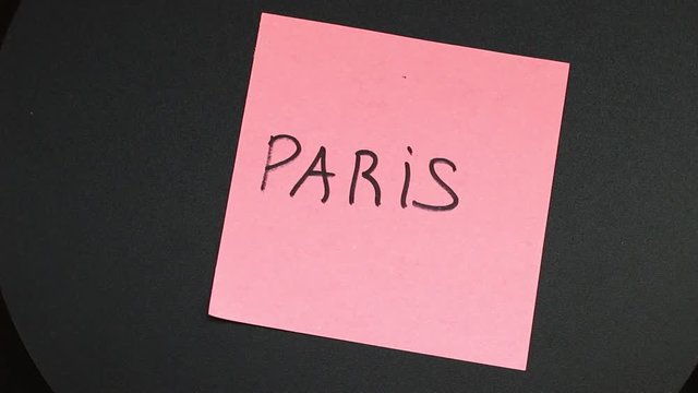 An inscription paris on a sticker that is spinning