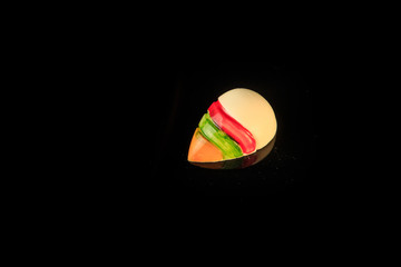 top view on single shell-shaped colorful chocolate candy