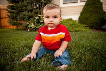 Baby Boy Sitting in Grass Outside - Color Portrait