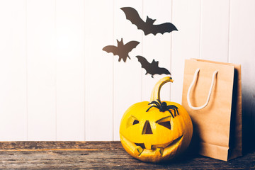 Scary halloween pumpkin with bats on white background. Halloween scene.