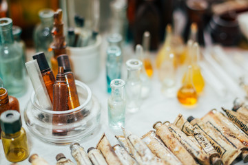 Many Old Medical Glass Capacity. Detail Of Retro Chemical Pharmaceutical Science Researches. Many Small Vintage Bottles And Glassware Different Sizes And Colors