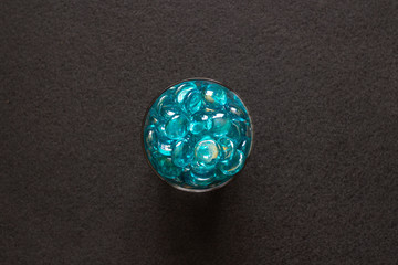 Decorative glass stones on a dark background