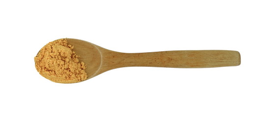 Turmeric, curcuma powder in a wooden spoon isolated on white background. Heap of turmeric.
