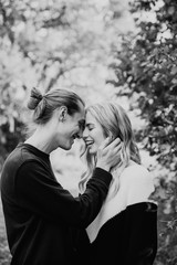 Young Cute Romantic Beautiful Loving Couple Face to Face Looking into Each Others Eyes Outside in Nature