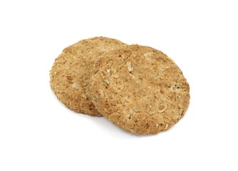 Round whole wheat biscuit, cookie with raisins isolated on white background. Biscuits with whole-wheat (wholemeal) flour isolated on white background 