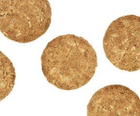 Round whole wheat biscuit, cookie with raisins isolated on white background. Biscuits with whole-wheat (wholemeal) flour isolated on white background 