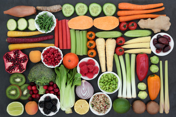 Large super health food collection for vegans and vegetarians with fresh fruit, vegetables, grains, herbs and spices. Very high in antioxidants, anthocyanins, vitamins and dietary fibre. Top view.