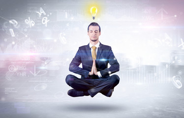 Businessman meditates with enlightenment data reports and financial concept
