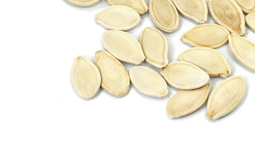 Heap of pumpkin seeds isolated on white background