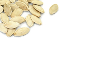 Heap of pumpkin seeds isolated on white background