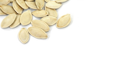 Heap of pumpkin seeds isolated on white background