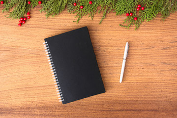 diary post card flyer Christmas composition. Christmas gift, pine cones, fir branches on wooden white background. Flat lay, top view