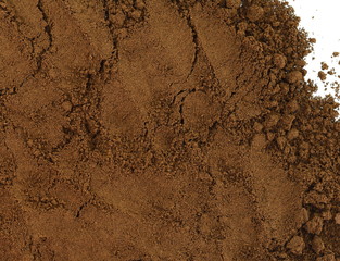 Coffee powder isolated of white background. A little coffee over a white surface. Milled coffee.