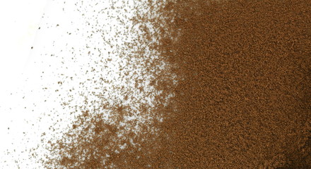 Pile of fresh ground coffee powder isolated on white.