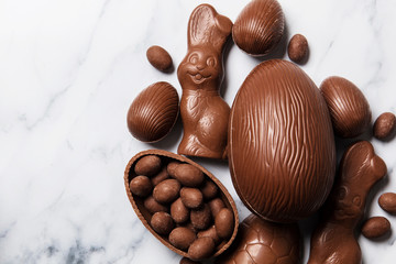 Chocolate easter eggs and bunnies on a marble background