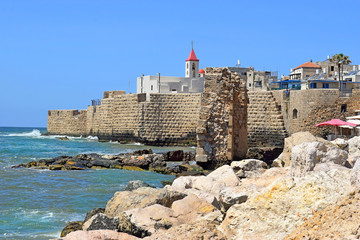 view of the fortress walls and St John's church, old city of Acre, Israel
