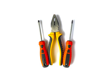 pliers and screwdrivers with rubberized handles on a white background