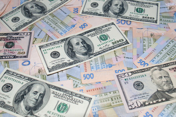Money, dollars and hryvnia, close-up, top view. The concept of the dollar and the hryvnia, finance, banks.