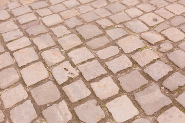 paving. the old road is made of stone. background texture stone walls