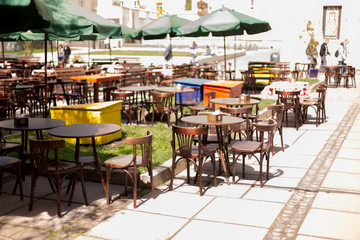 an outdoor Playground, a summer café. restaurant tables on the street