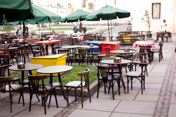 an outdoor Playground, a summer café. restaurant tables on the street
