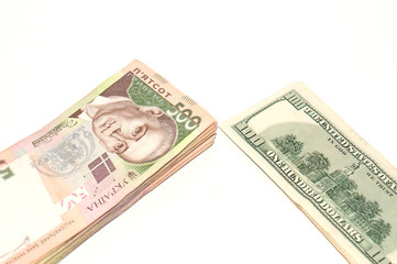 Ukrainian hryvnia and the dollar on a white background, isolate. Problems in the economy, inflation