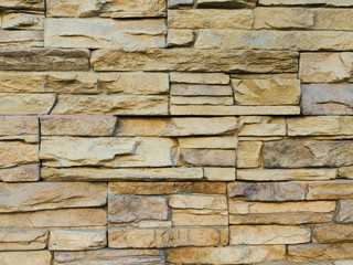 The texture of flagstone wall. Closeup of the texture of flagstone wall