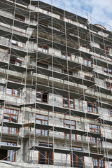 new building under construction, scaffolding and concrete