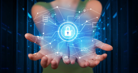 Man holding hologram projection displaying cloud technology symbols
