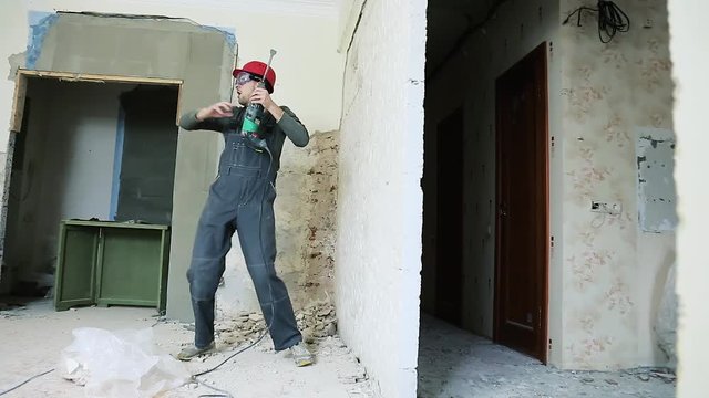 Construction worker with perforator