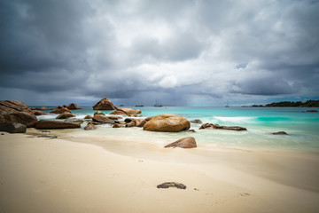Fototapeta na wymiar Sailboats on a cloudy day at beach anse lazio, praslin, seychelles 1