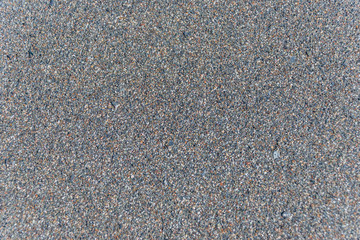 Closeup of Black Sand on a Volcanic Beach in Sicily for Backgrounds