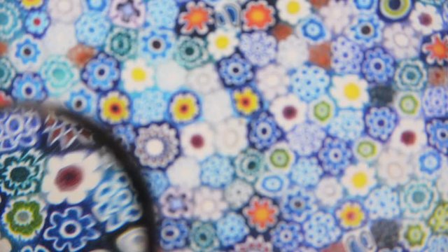 Murrine colored patterns concept view through magnifying glass