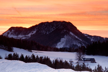 sunrise behind a mountain