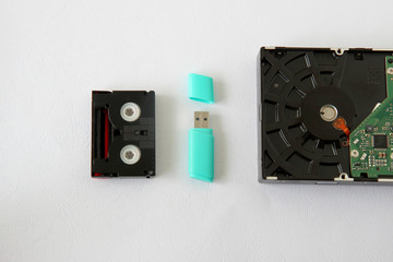means of storing information: hard disk drive,  flash drive,  mini dv cassette